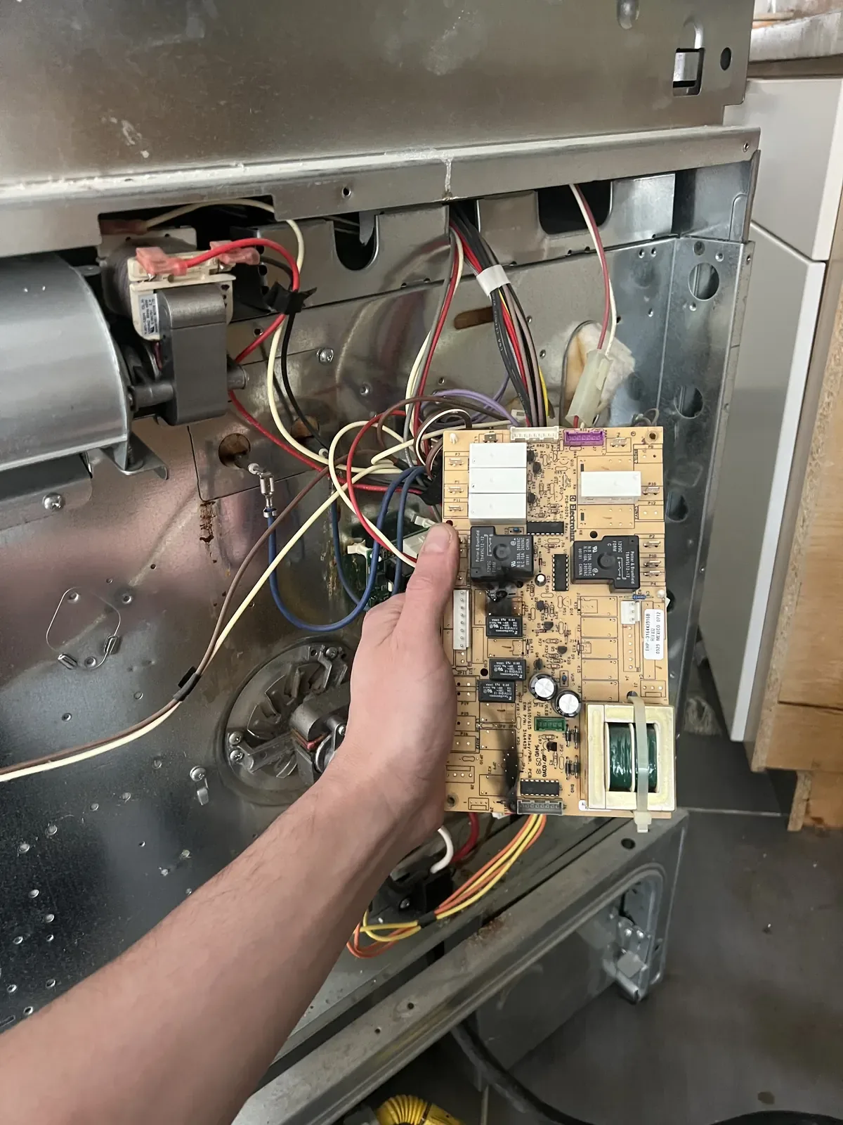 Replacing a faulty appliance control board with a genuine OEM part